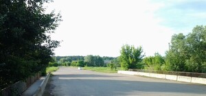 Власти обещают достроить мост через реку Лопань