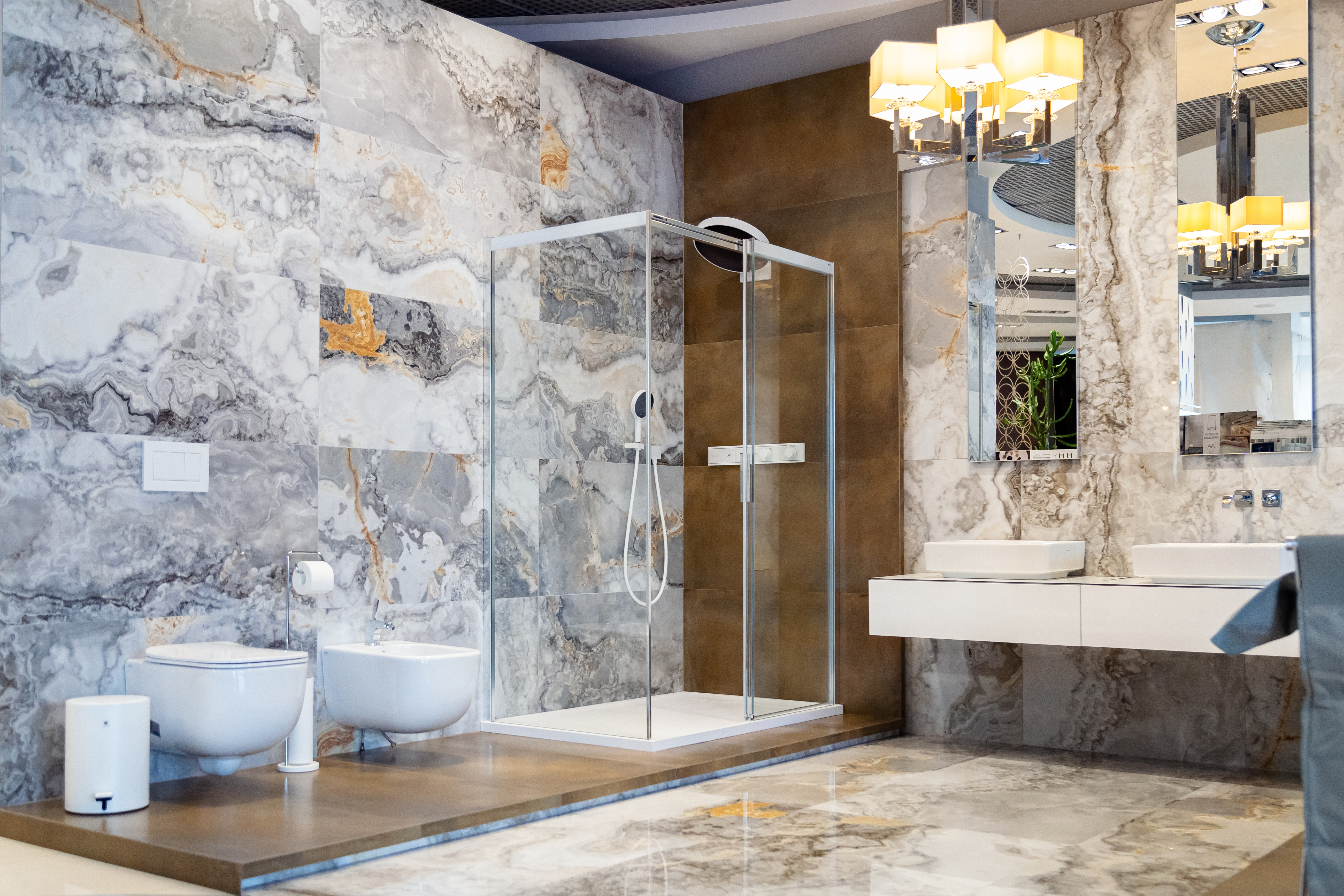 Сантехніка та душова кабіна Duka, душова система Hansgrohe, меблі Geberit, ванна Treesse, плитка La Faenza